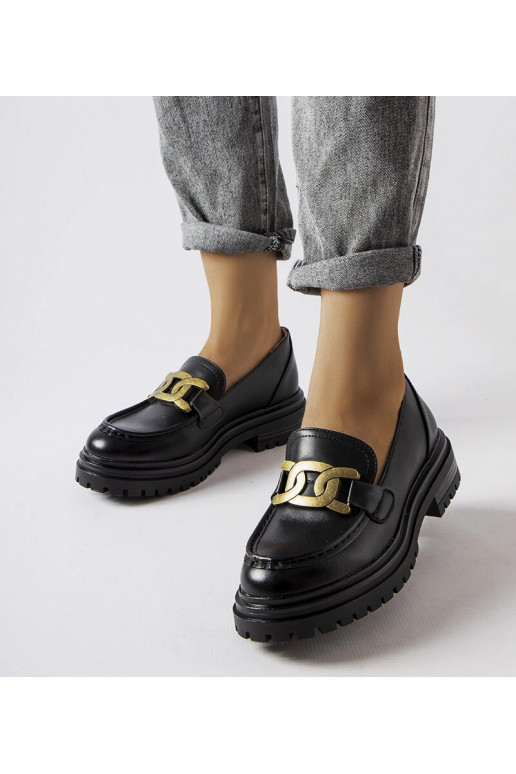 Schwarze Loafer verziert mit einer... Schwarze Loafer verziert mit einer...