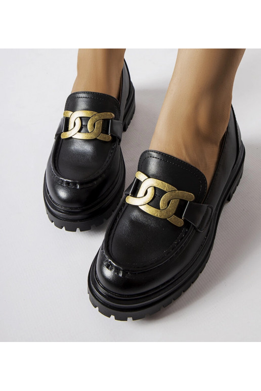 Schwarze Loafer verziert mit einer... Schwarze Loafer verziert mit einer...