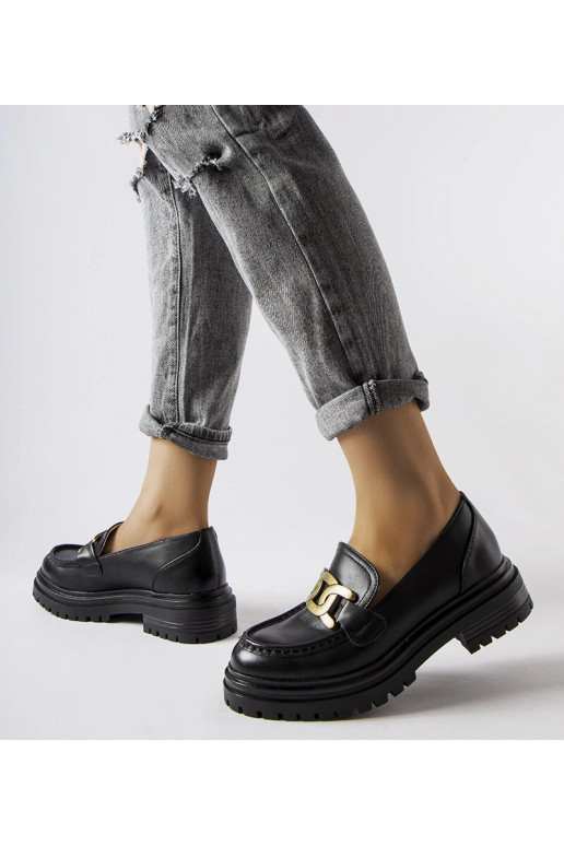 Schwarze Loafer verziert mit einer... Schwarze Loafer verziert mit einer...